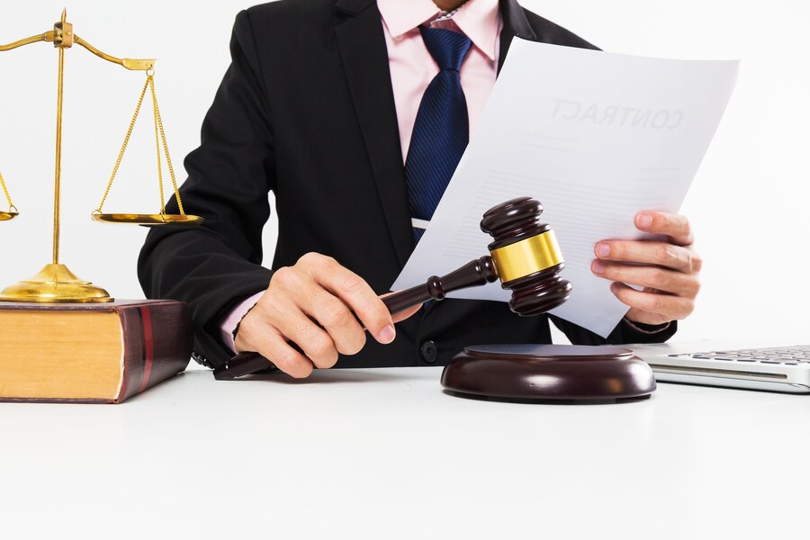 young-lawyer-with-wooden-gavel-room_35675-197